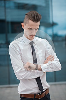 Smart businessman manager looking at watch, watch the time. business concept.