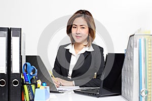 The smart businesswoman Asian working in office on the table