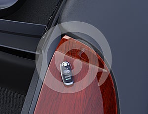 Smart car key on electric car`s dashboard