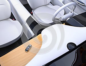 Smart car key on electric car`s dashboard