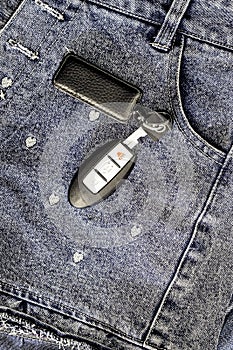 smart car key over girl jeans