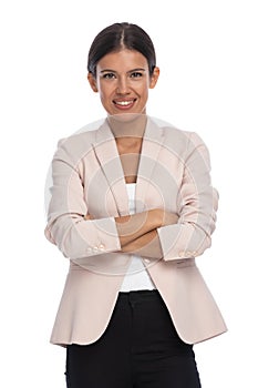 Smart casual brunette woman wearing pink jacket and smiling