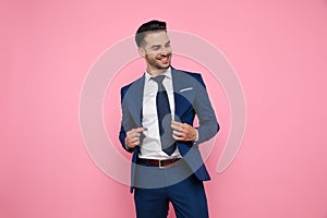 Smart casual man goofing around on pink background