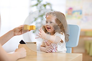 Smart child with didactic toys in preschool photo