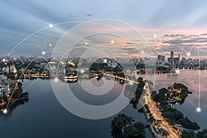 Smart city and wireless communication network concept. Digital network connection lines of Hanoi city at West Lake or Ho Tay