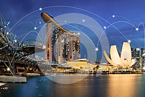 Smart city and wireless communication network concept. Digital network connection lines of Singapore at Marina Bay