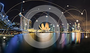 Smart city and wireless communication network concept. Digital network connection lines of Singapore at Marina Bay