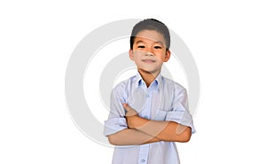 Smart and clever Asian boy standing with his arms crossed over isolated white background.