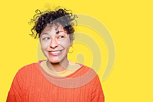 Smart and clever black woman face expression on yellow background