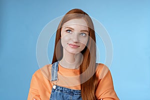 Smart creative pretty redhead female freelancer thoughtfully look upper left corner pondering decision smirking thinking