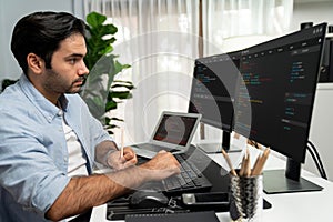 IT developer writing data memo software development on paper's coding. Surmise.