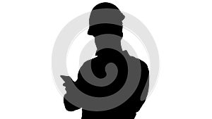 Smart engineer in white shirt and safety engineering hat using s