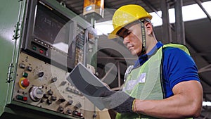 Smart factory worker using machine in factory workshop