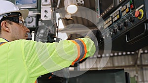 Smart factory worker using machine in factory workshop