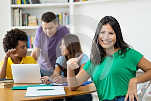 Smart female student with group of multi ehtnic students