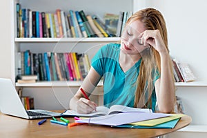 Smart german female student learning on computer