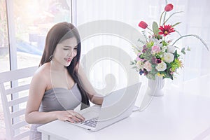 Smart girl`s working on notebook , Workingwoman using laptop in