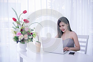Smart girl`s working on notebook , Workingwoman using laptop in