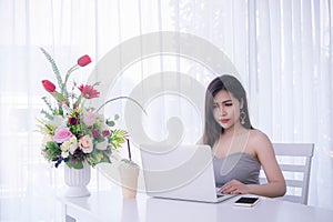 Smart girl`s working on notebook , Workingwoman using laptop in the room