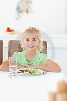 Smart girl sitting eat her healthy salad