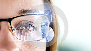 Smart glasses and augmented reality concept. Woman wearing moder spectacles. photo