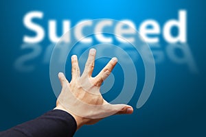 Smart Hand grab the word Succeed