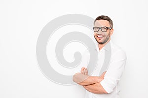 Smart happy businessman in glasses with crosed hands on white background