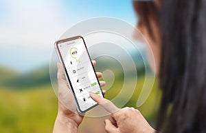 Smart health app on mobile phone in woman hand photo