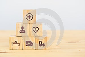 Smart health care, insurance concept, wooden cube symbolize insurance to protect or cover person, Property ,Liability, reliability