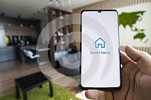 smart home app on smartphone. remote control of electronic devices in apartment. concept of controlling smart electronics in the