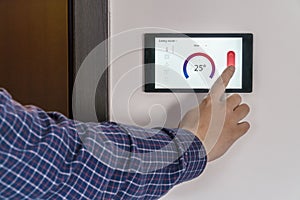 Smart home climate control device on a wall