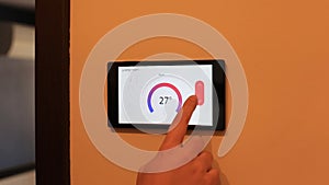 Smart home climate control device on a wall