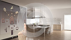 Smart home control concept, hand controlling digital interface from mobile app. Blurred background showing modern kitchen, archite