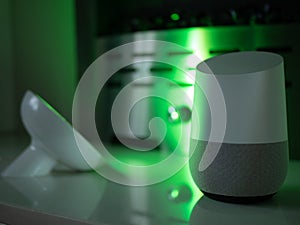 Smart home speaker device lit with colour changing LED lamp light - Green