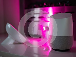 Smart home speaker device lit with colour changing LED lamp light - Pink