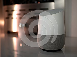 Smart home speaker in evening on mantel of fireplace