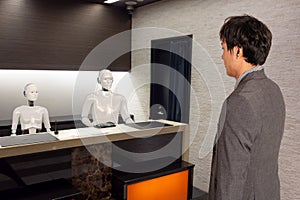 Smart hotel in hospitality industry 4.0  concept, the receptionist robot robot assistant  in lobby of hotel or airports always w