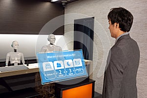 Smart hotel in hospitality industry 4.0  concept, the receptionist robot robot assistant  in lobby of hotel or airports always w