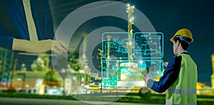 Smart industrial engineer using digital interface to control factory automation system and process data visualization. Concept of