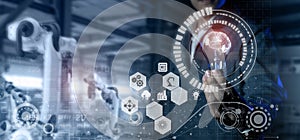 smart industry 4.0 futuristic technology concept, engineer hold the light bulb with the brain of artificial intelligence to contro photo
