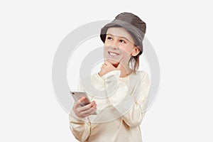 Smart kid holding a mobile phone. Technology, lifestyle and people concept