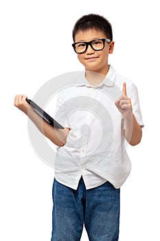Smart kid holding tablet with smile and finger pointing upwearing eyeglasses