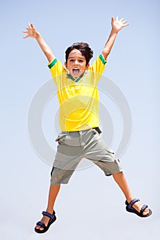 Smart kid jumping high in air photo