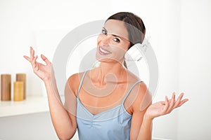 Smart latin woman with headphones looking relaxed