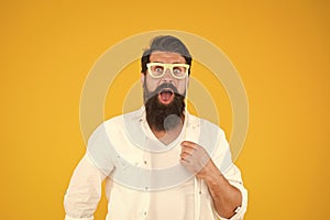 Smart nerd eyeglasses. Guy with beard and mustache hold eyeglasses photo booth prop. Last minute costume party ideas