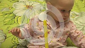 Smart Newborn Playing with a Pyramid Toy. 4K UltraHD, UHD