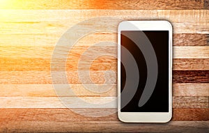 Smart phone with blank screen lying on table