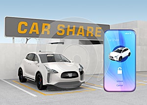 Smart phone with car sharing app in front of the white car