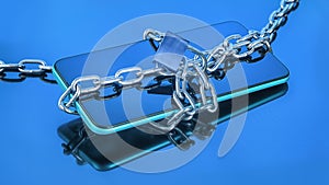 Smart phone in chain with lock on blue background with selective focus and reflection