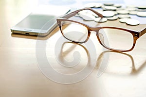 Smart phone, Coins and glasses